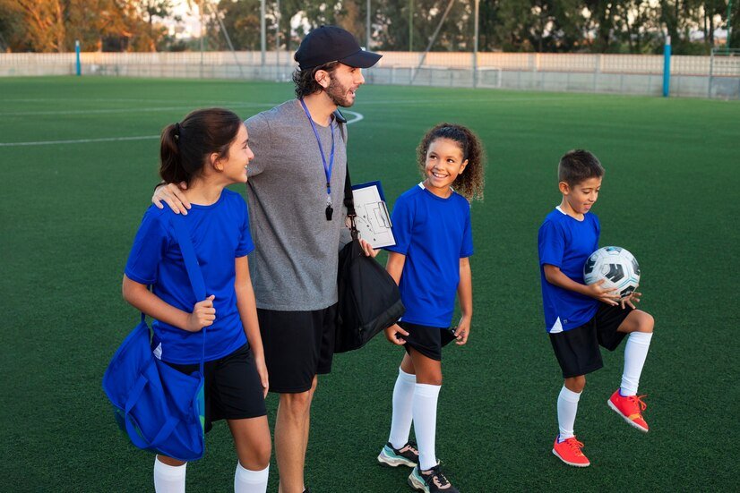 side-view-football-trainer-teaching-kids