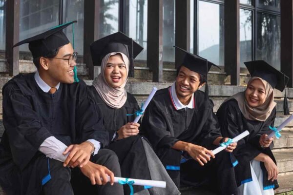 students celebrating graduation