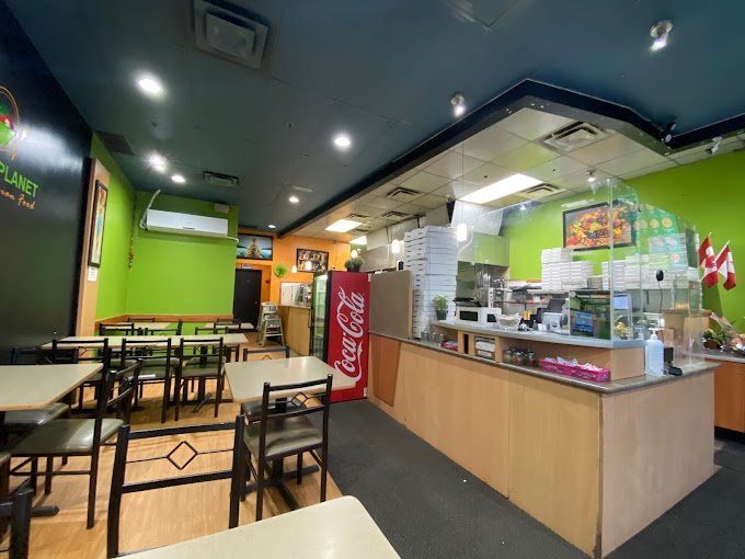 dining area at Veggie Planet Mississauga, serving delicious Indian street food in a vibrant setting